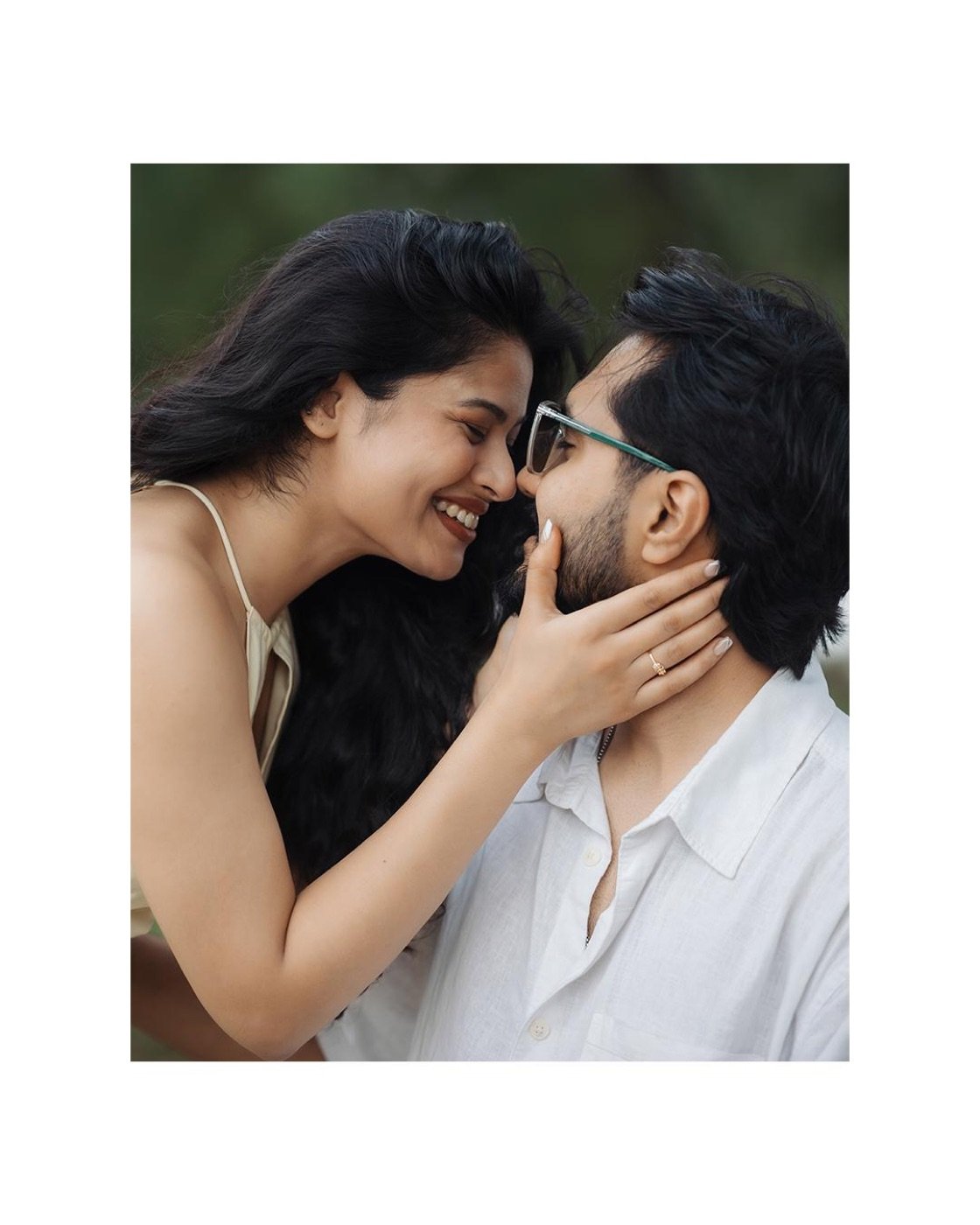 Ananya holding Rohan's face, laughing